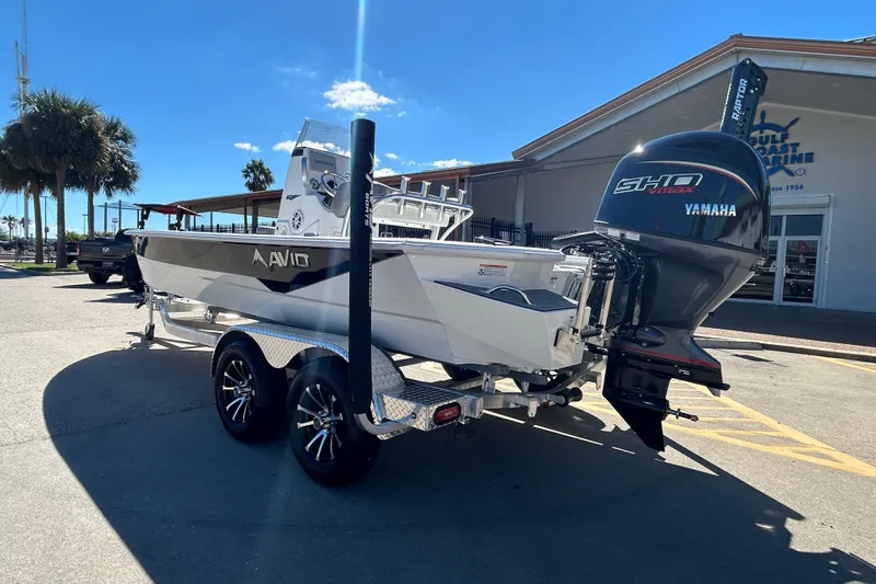Slide: The Image of 2026 Avid 21 FST boat with Yamaha engine on trailer, parked outside dealership. - 7
