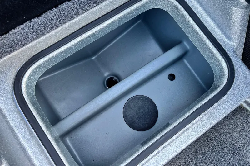 Slide: The Image of 2024 Triton 18 TrX boat storage compartment, featuring a sleek, durable design. - 7