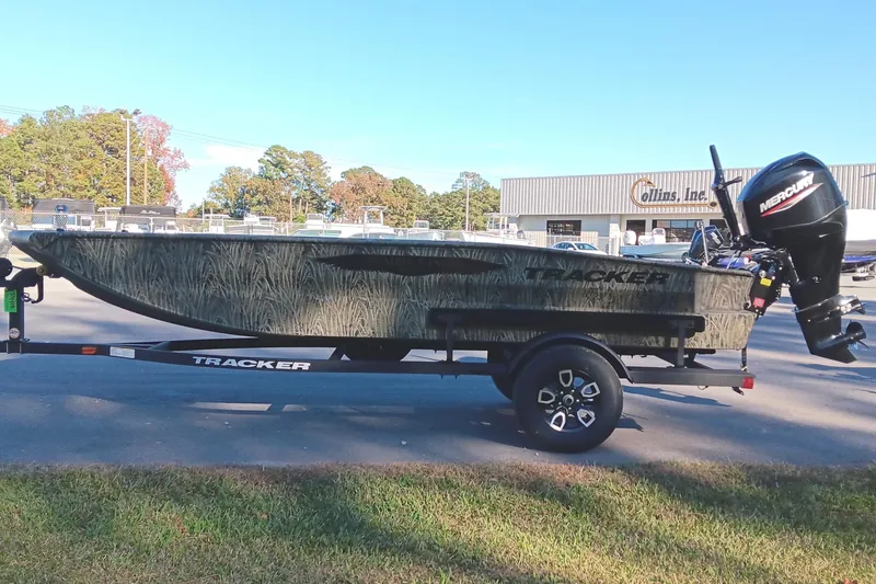 Slide: The Image of 2026 Tracker Grizzly 1650 T Prairie Wings Edition boat on trailer, outdoors. - 6