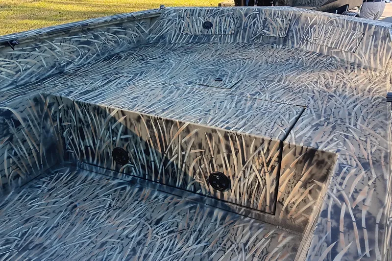 Slide: The Image of 2026 Tracker Grizzly 1650 T Prairie Wings Edition with camouflage interior design. - 9