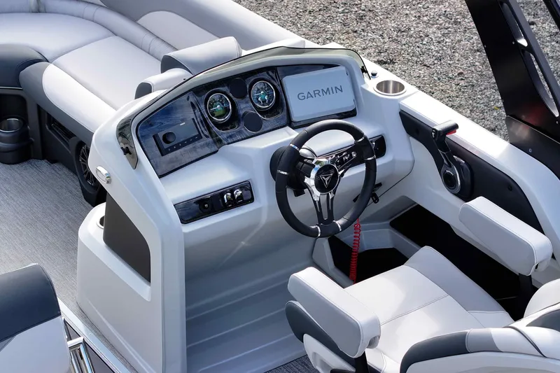 Slide: The Image of 2026 Tahoe Pontoon LTZ Entertainer dashboard with Garmin navigation and luxurious seating. - 6