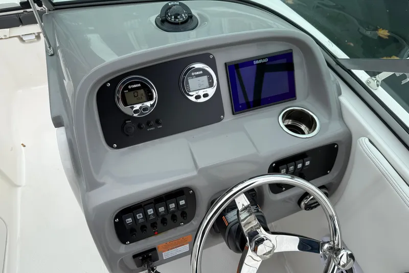 Slide: The Image of 2025 Robalo R207 Dual Console dashboard with Yamaha gauges and Simrad display. - 7