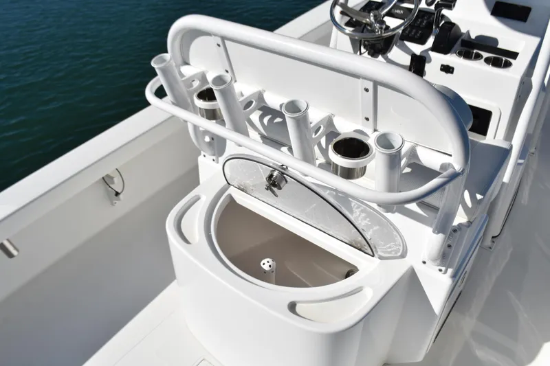Slide: The Image of 2020 BlackJack 256 Coastal boat console with rod holders and steering wheel. - 24