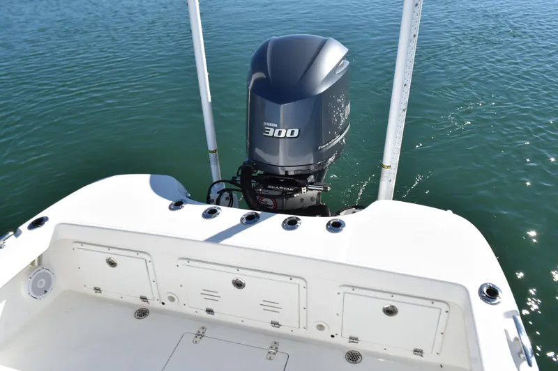 Slide: The Image of 2020 BlackJack 256 Coastal boat with Yamaha 300 outboard motor on calm water. - 26