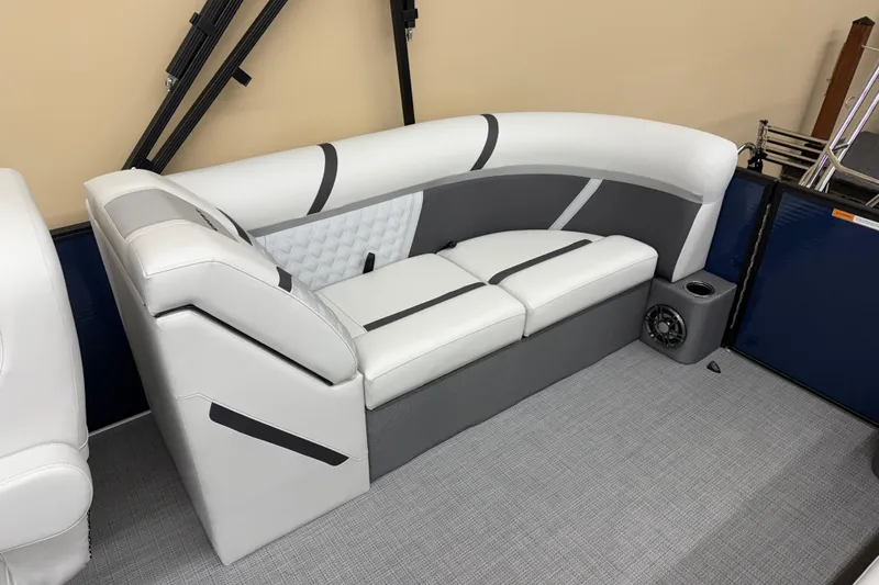 Slide: The Image of 2025 Crest Classic 240 boat interior with modern white and gray seating. - 10