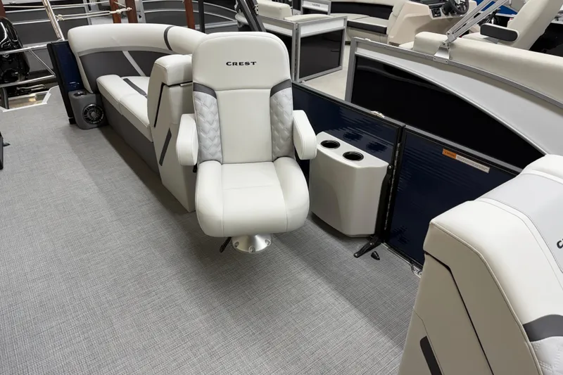 Slide: The Image of 2025 Crest Classic 240 boat interior with plush seating and modern design. - 5