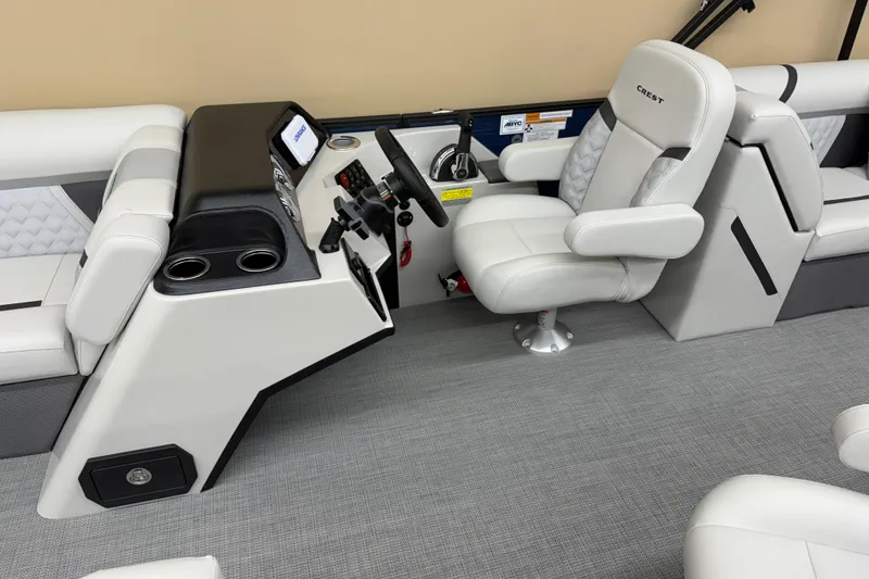 Slide: The Image of 2025 Crest Classic 240 boat interior with modern helm and comfortable seating. - 6