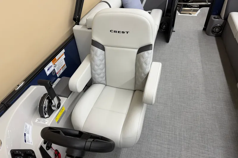 Slide: The Image of Captain's chair in 2025 Crest Classic 240 boat, featuring sleek design and modern controls. - 8