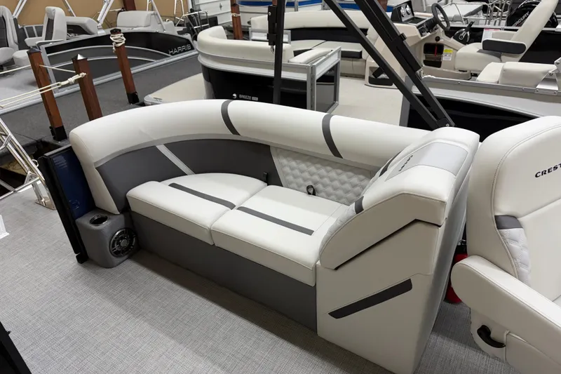 Slide: The Image of 2025 Crest Classic 240 boat interior with modern seating and sleek design. - 9
