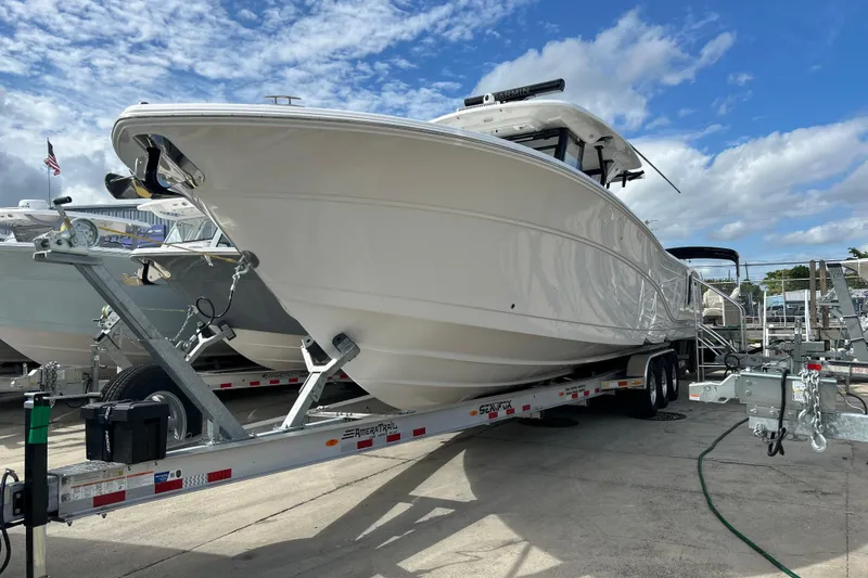 The Image of 2026 Sea Fox 368 Commander boat on trailer under a blue sky. - 1