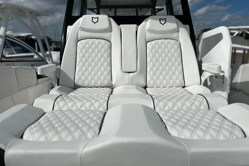 Slide: The Image of Luxurious seating on 2026 Sea Fox 368 Commander boat with quilted white upholstery. - 10