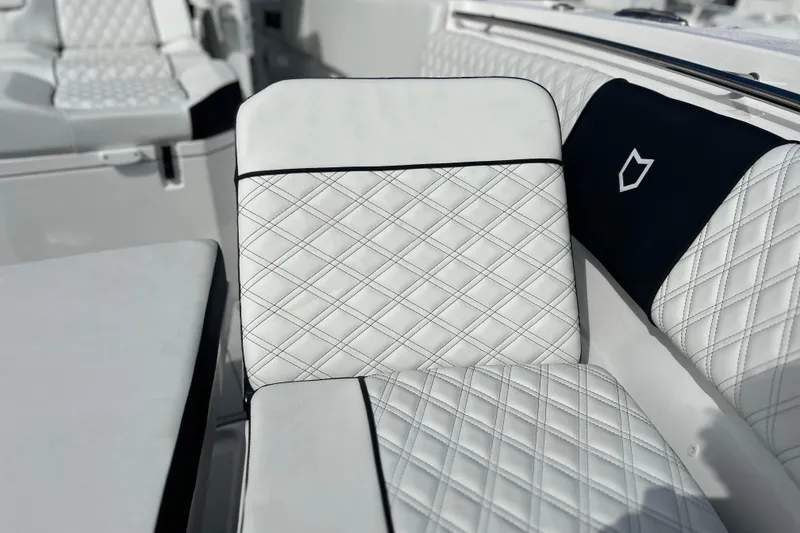 Slide: The Image of Luxurious white seating on 2026 Sea Fox 368 Commander boat, featuring diamond stitching. - 12