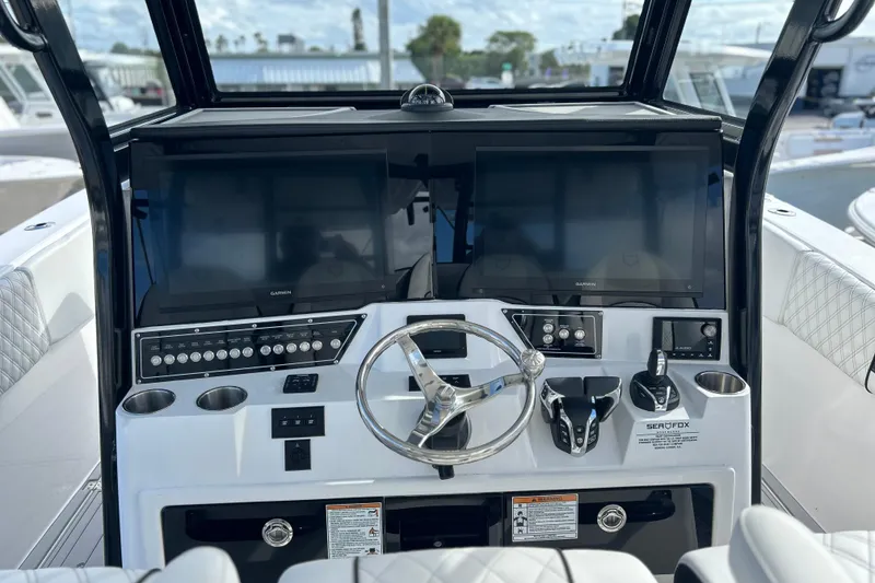 Slide: The Image of 2026 Sea Fox 368 Commander helm with dual screens and modern controls. - 19