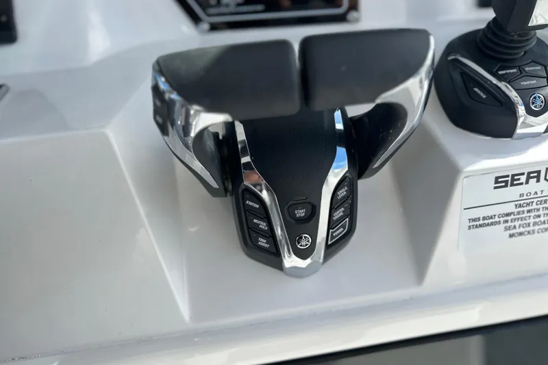 Slide: The Image of 2026 Sea Fox 368 Commander boat controls with modern throttle and joystick. - 24
