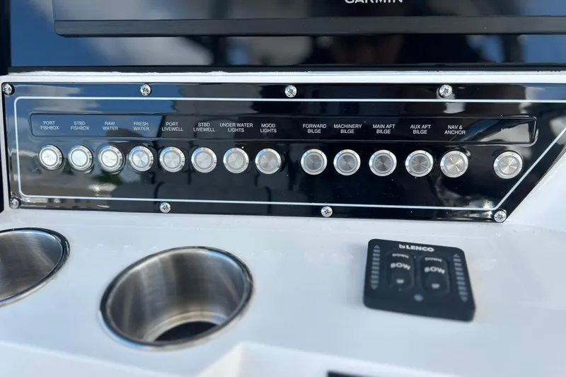 Slide: The Image of Control panel of 2026 Sea Fox 368 Commander boat with labeled buttons and switches. - 26