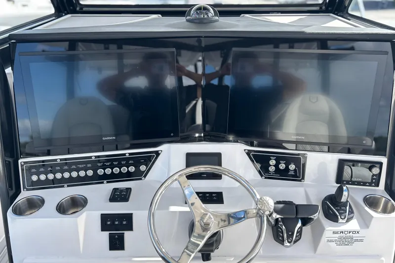 Slide: The Image of 2026 Sea Fox 368 Commander dashboard with dual Garmin displays and modern controls. - 27