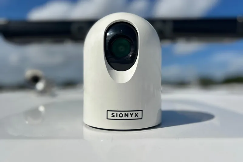 Slide: The Image of SIONYX camera on 2026 Sea Fox 368 Commander boat, clear sky background. - 32