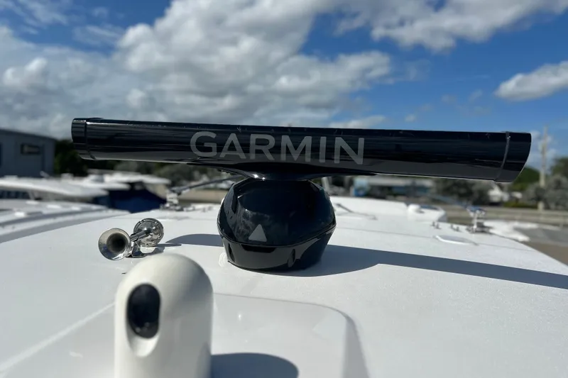 Slide: The Image of Garmin radar on 2026 Sea Fox 368 Commander boat under a cloudy sky. - 33