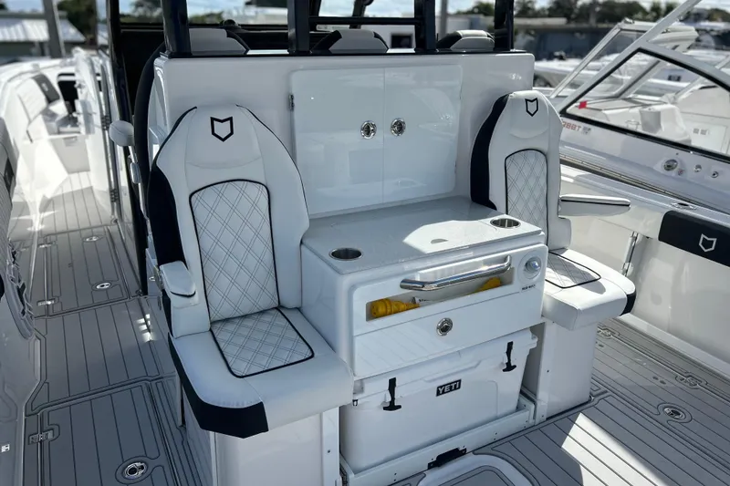 Slide: The Image of 2026 Sea Fox 368 Commander boat interior with cushioned seating and storage. - 37