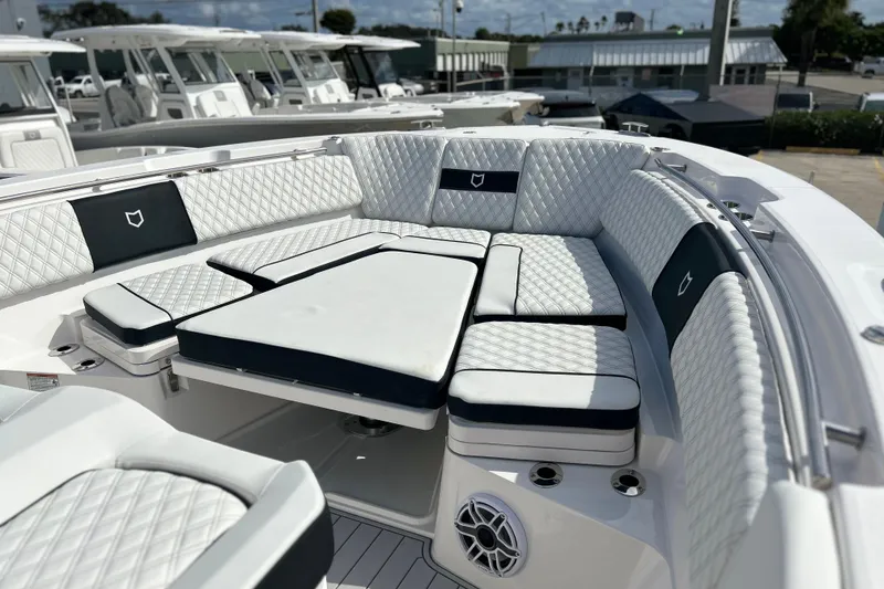Slide: The Image of Luxurious seating area on 2026 Sea Fox 368 Commander boat, featuring quilted upholstery. - 4