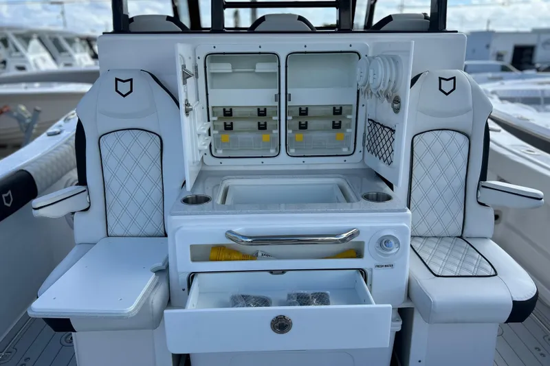 Slide: The Image of 2026 Sea Fox 368 Commander boat interior with seating and storage compartments. - 42