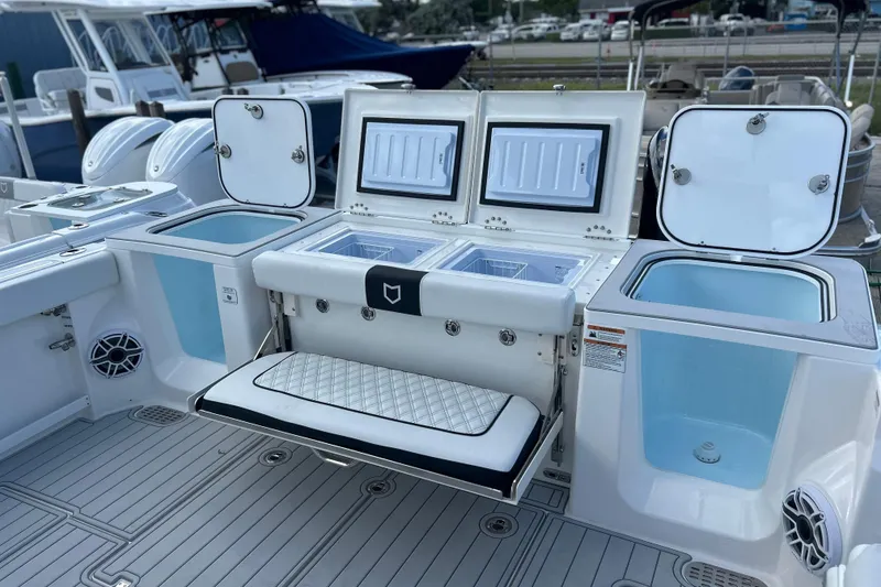 Slide: The Image of 2026 Sea Fox 368 Commander boat with open storage compartments and seating. - 47