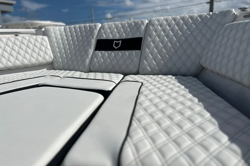 Slide: The Image of Luxurious seating on 2026 Sea Fox 368 Commander boat with quilted white upholstery. - 7