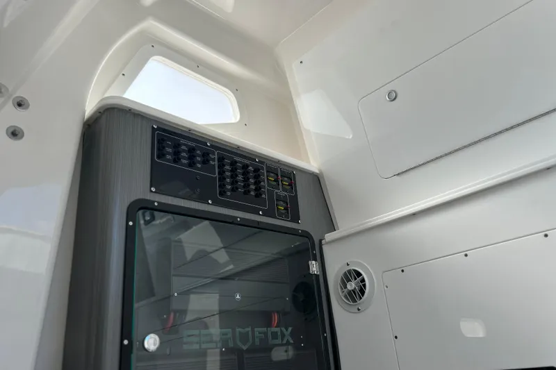 Slide: The Image of Interior view of 2026 Sea Fox 368 Commander boat, featuring control panel and storage. - 70