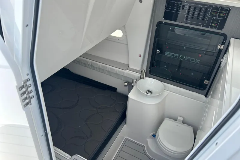 Slide: The Image of Interior of 2026 Sea Fox 368 Commander boat with compact bathroom and control panel. - 71