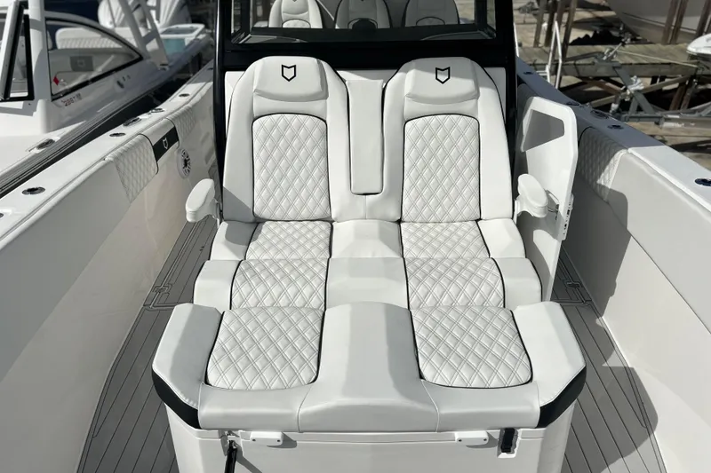 Slide: The Image of Luxurious seating on 2026 Sea Fox 368 Commander boat, featuring elegant white upholstery. - 9