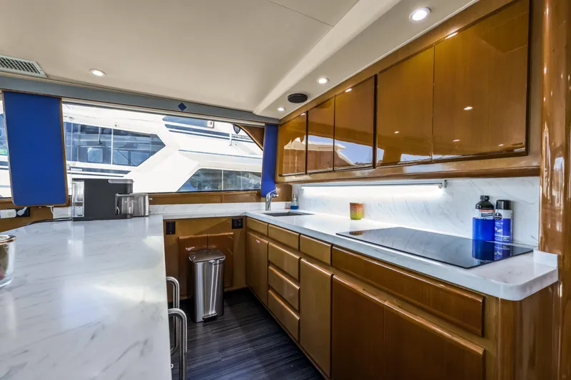 Slide: The Image of Luxurious kitchen interior of 1999 Viking 58 Convertible yacht with modern amenities. - 18