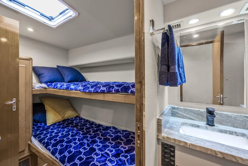Slide: The Image of Interior of 1999 Viking 58 Convertible yacht with bunk beds and bathroom. - 19