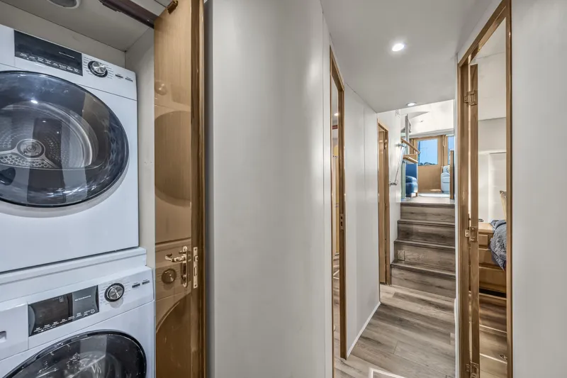 Slide: The Image of Interior hallway of 1999 Viking 58 Convertible yacht with laundry appliances. - 22