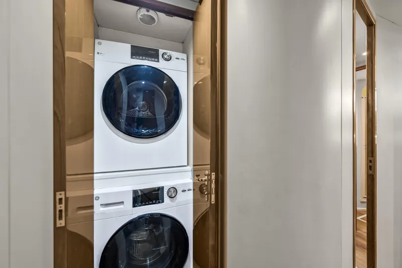 Slide: The Image of Stacked washer and dryer in 1999 Viking 58 Convertible yacht interior. - 23