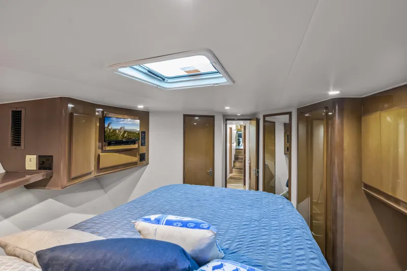 Slide: The Image of Luxurious cabin interior of 1999 Viking 58 Convertible yacht with skylight and TV. - 30