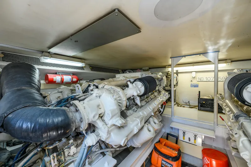 Slide: The Image of Engine room of 1999 Viking 58 Convertible yacht with visible machinery and equipment. - 44