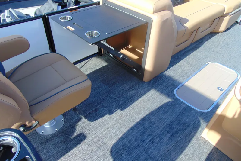 Slide: The Image of Interior of 2026 Godfrey Sweetwater 2486 QS iMPACT, featuring seating and table with cup holders. - 14