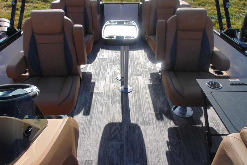 Slide: The Image of 2026 Godfrey Sweetwater 2486 QS iMPACT Package interior with luxurious seating and modern design. - 7