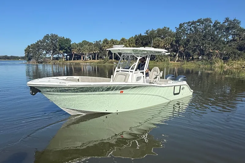 The Image of 2021 Sea Fox 268 Commander boat on calm water, surrounded by trees. - 0