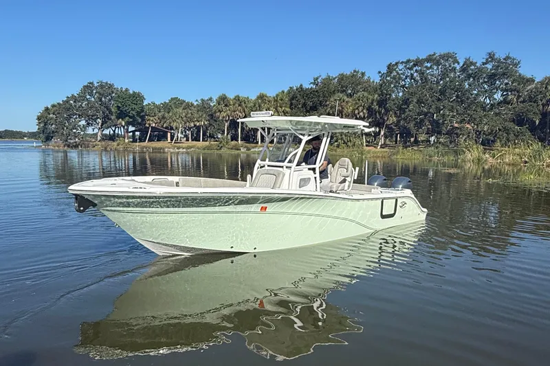 Slide: The Image of 2021 Sea Fox 268 Commander boat on calm water with scenic background. - 1