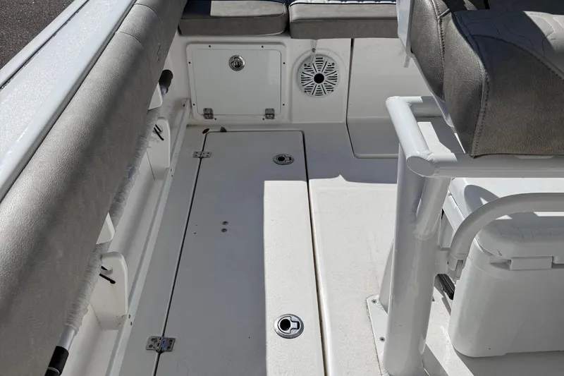 Slide: The Image of Interior view of a 2021 Sea Fox 268 Commander boat, featuring seating and storage compartments. - 30