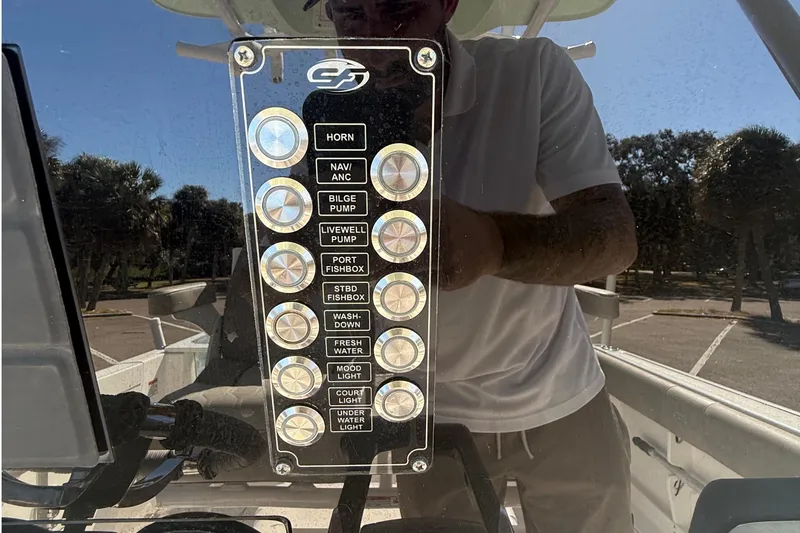Slide: The Image of Control panel of a 2021 Sea Fox 268 Commander boat with various labeled buttons. - 32