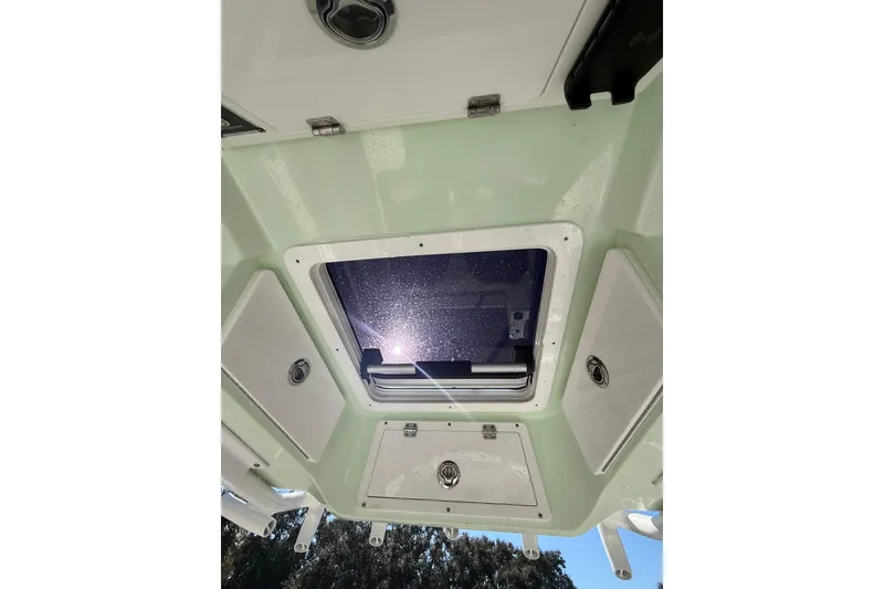 Slide: The Image of 2021 Sea Fox 268 Commander boat interior ceiling with hatch and storage compartments. - 36