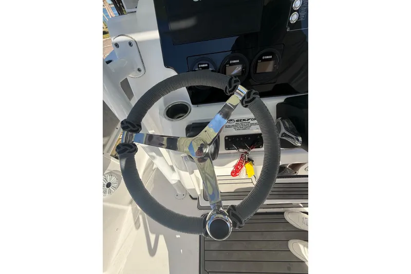 Slide: The Image of Steering wheel of 2021 Sea Fox 268 Commander boat, featuring modern controls and dashboard. - 37