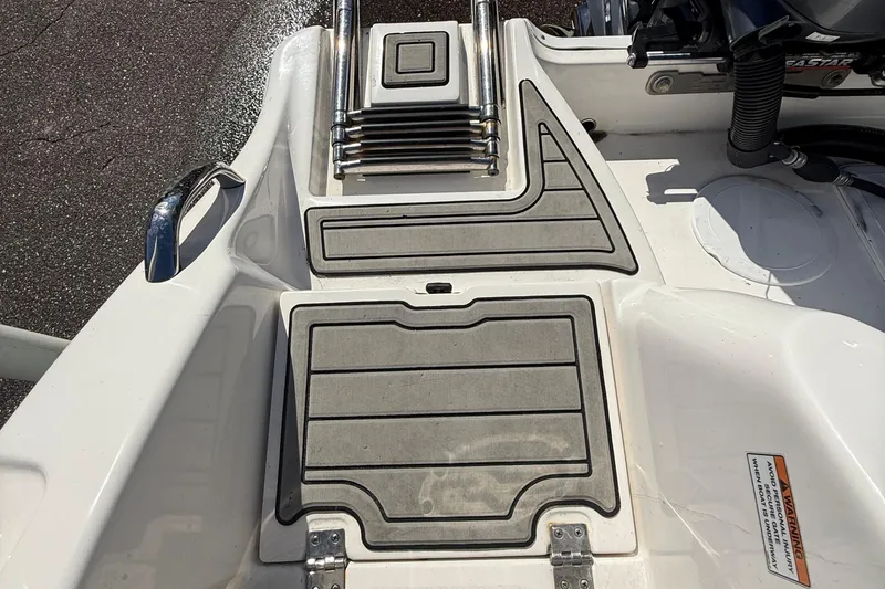 Slide: The Image of 2021 Sea Fox 268 Commander boat deck with non-slip surface and ladder. - 48