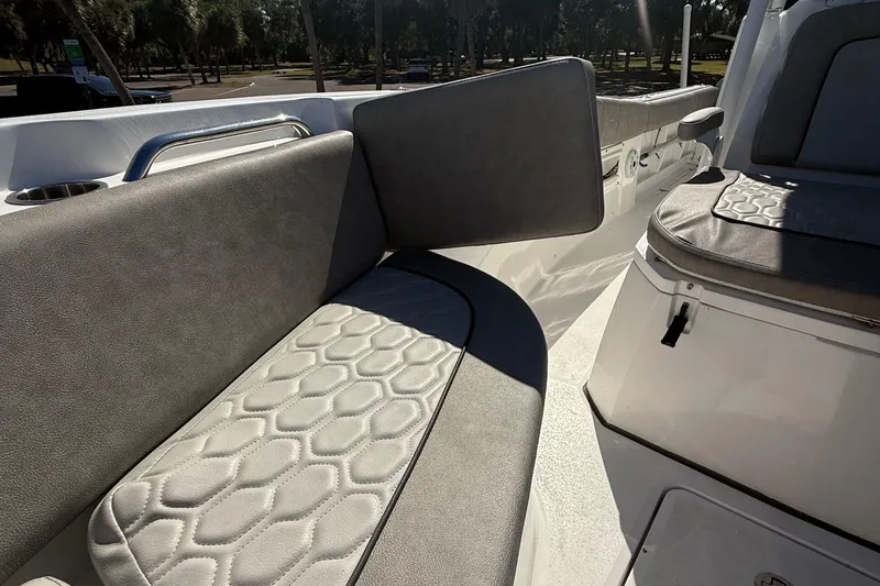 Slide: The Image of 2021 Sea Fox 268 Commander boat seating with textured upholstery and cup holder. - 53
