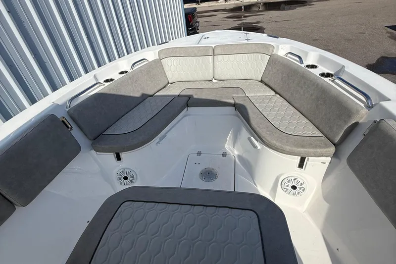 Slide: The Image of 2021 Sea Fox 268 Commander boat interior with gray cushioned seating and cup holders. - 56