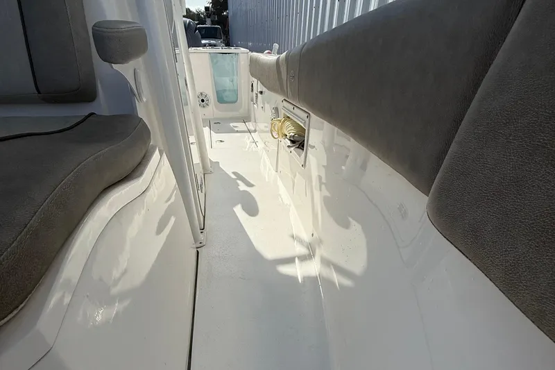 Slide: The Image of 2021 Sea Fox 268 Commander interior with cushioned seating and storage. - 58