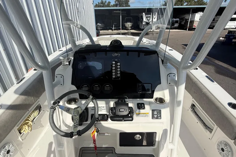Slide: The Image of 2021 Sea Fox 268 Commander boat dashboard with steering wheel and controls. - 63