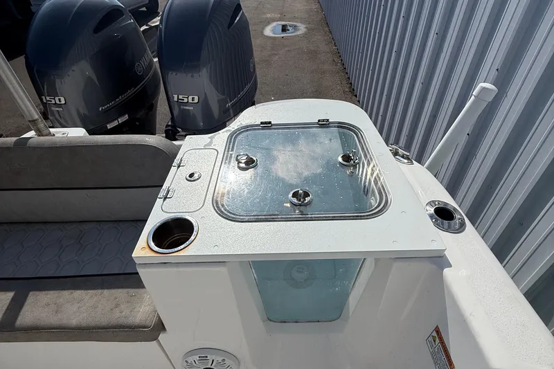 Slide: The Image of 2021 Sea Fox 268 Commander boat with dual Yamaha 150 engines, featuring a livewell and seating area. - 65